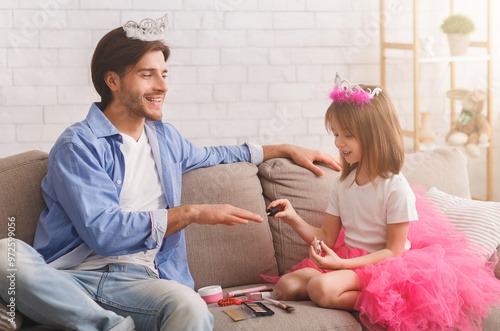 You are my best friend. Little pretty princess coloring her dad nails with polisher, daddy wearing crown, enjoying time with his daughter, free space