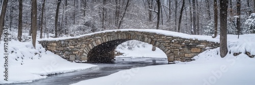 Fresh Snow Blanketing an Ancient Stone Bridge photo