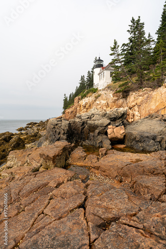 A view of Bass Harbor Head Light Station up on the cliffs of coastal Maine. photo