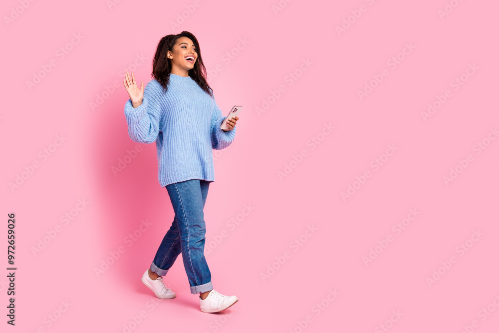 Full body portrait of nice young girl smart phone walk wave empty space isolated on pink color background Full body portrait of nice young girl smart phone walk wave empty space isolated on pink color background