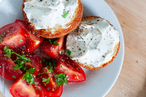 Healthy Breakfast tomato salad, muffins with cream cheese and herbs