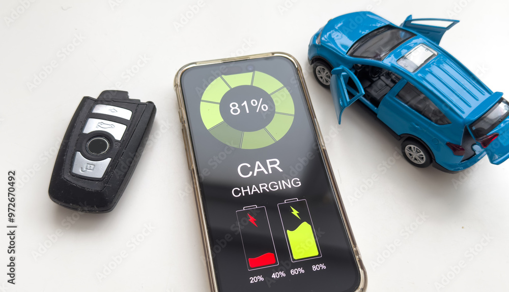 Obraz premium Mobile phone displaying Electric Car EV battery charging station charging in car port, efficient sustainable eco environmental power energy fueling industry of eclectic vehicle car transportation