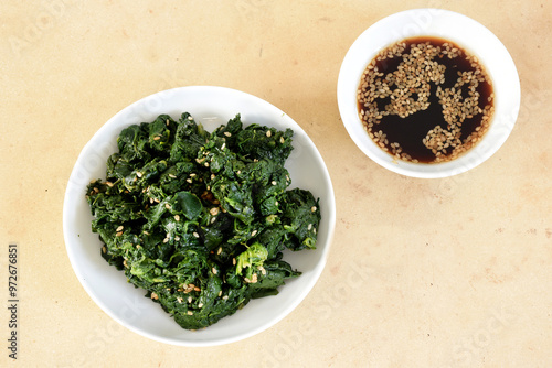 Horenso no Gomae is a Japanese side dish. It is made with spinach and sesame dressing. A fresh and healthy meal that is easy to make at home. photo