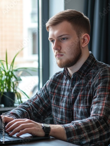 Young Man Working on Laptop