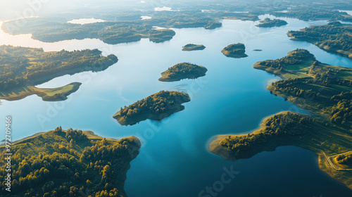 A stunning aerial view of a winding lake, with intricate shorelines and islands dotted throughout the water.