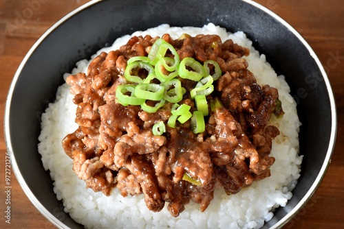 Miso meat sauce (Niku Miso) is a tasty Japanese side dish of minced meat seasoned with miso (fermented soybean paste), mirin and spices. It is often served as a topping on a bowl of rice. photo