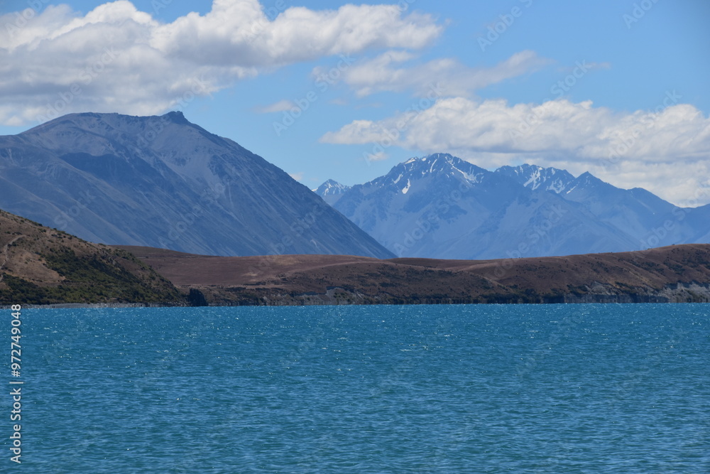 The stunning scenery and landscapes around the blue Lake Tekapo on the South Island of New Zealand The stunning scenery and landscapes around the blue Lake Tekapo on the South Island of New Zealand
