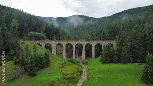A stunning drone video of Chmarošský Viaduct in Slovakia showcases its impressive stone arches, nestled in lush forests and scenic mountain landscapes