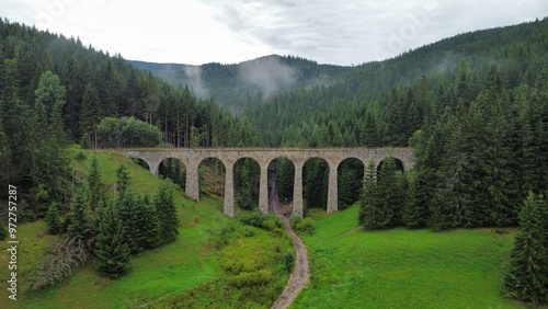 A stunning drone video of Chmarošský Viaduct in Slovakia showcases its impressive stone arches, nestled in lush forests and scenic mountain landscapes