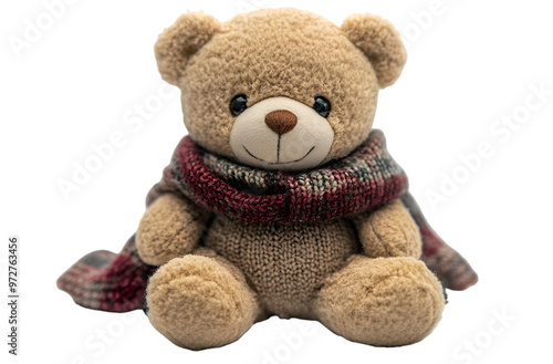 A teddy bear wearing a colorful scarf, set against a solid black background, exuding warmth and charm.
