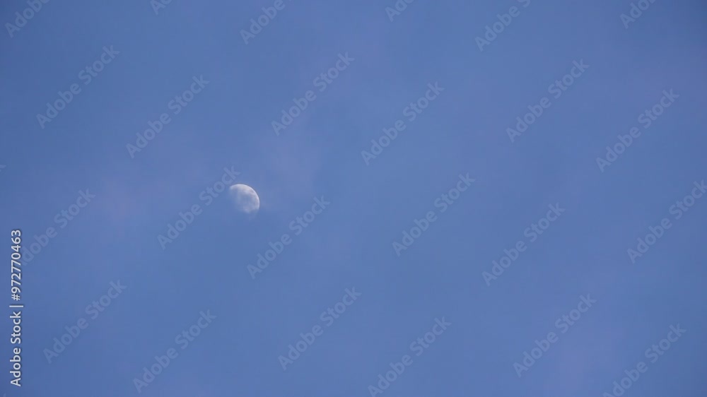 half moon shining from covering rain cloud on sky in twilight background half moon shining from covering rain cloud on sky in twilight background