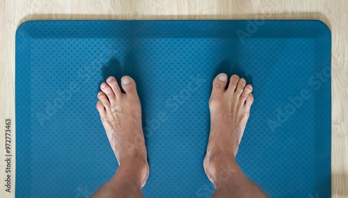 feet on anti fatigue floor mat for standing work