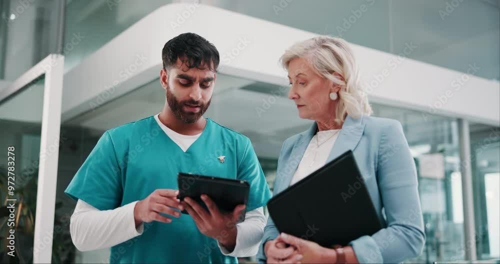 Doctors, team and tablet for surgery plan in hospital, talking and online for results or schedule. Mature woman, man and website for consulting on medical record, speaking and review clinic policy Doctors, team and tablet for surgery plan in hospital, talking and online for results or schedule. Mature woman, man and website for consulting on medical record, speaking and review clinic policy