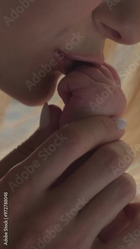 Wallpaper Mural Caring mothers hands hold the hand of the child. Focus on hands close-up. Vertical video. Torontodigital.ca