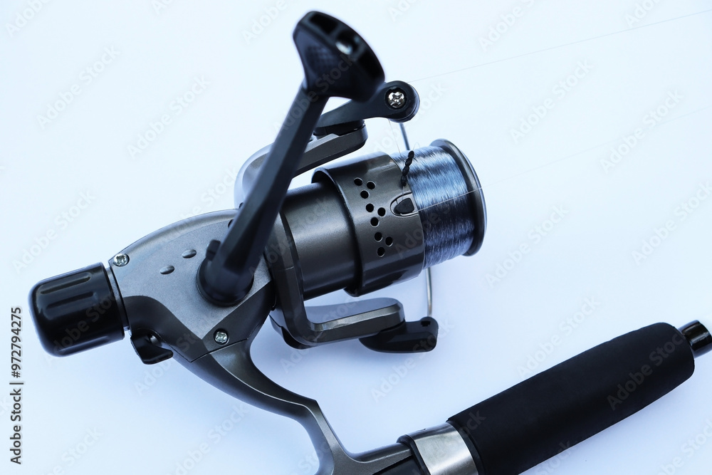 professional fishing reel on a white background professional fishing reel on a white background