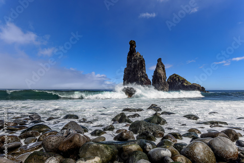 Waves breaking at the Ilheus da Janela, bizarre shaped rock formations on the norht coast of Madeira, Portugal. photo