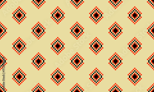 a detailed pattern composed of pixel designs with orange and black square on yellow background , design for fabric or various pattern printing works.