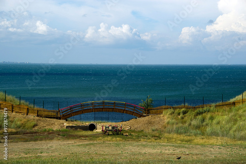 View of a fairytale bridge against the backdrop of the sea.