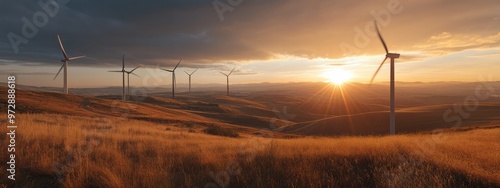 Wind Turbines on a City Outskirts Hill, Blades Capturing the Glow of the Setting Sun photo