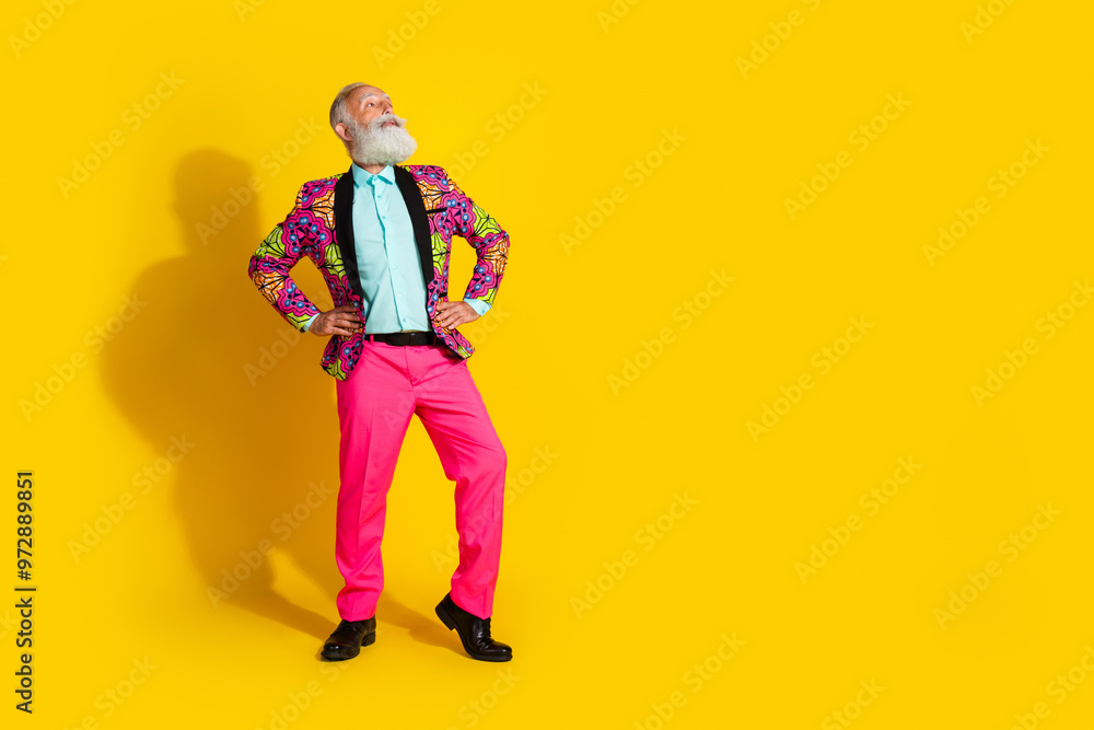 Fototapeta premium Full size photo of handsome pensioner mister confident pose look empty space dressed colorful pink garment isolated on yellow background