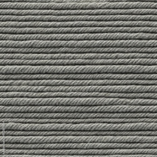 A close-up shot of a single gray yarn strand