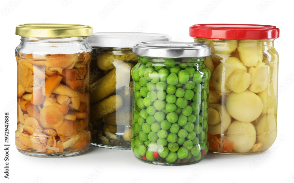 Different pickled products in jars isolated on white Different pickled products in jars isolated on white