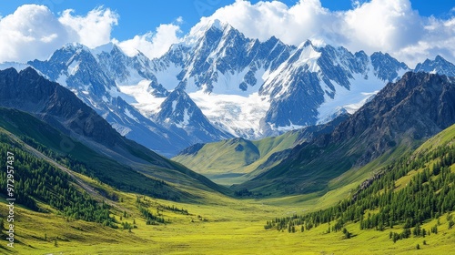 Snow-capped peaks of the Altai mountains in Mongolia, towering above a lush green valley