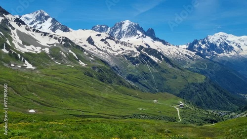 Beautiful summer view of Mont Blanc mountain range, Chamonix, Alps, France, sky, flowers, green fields
