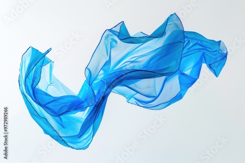 A vibrant cerulean plastic bag dancing playfully in the breeze