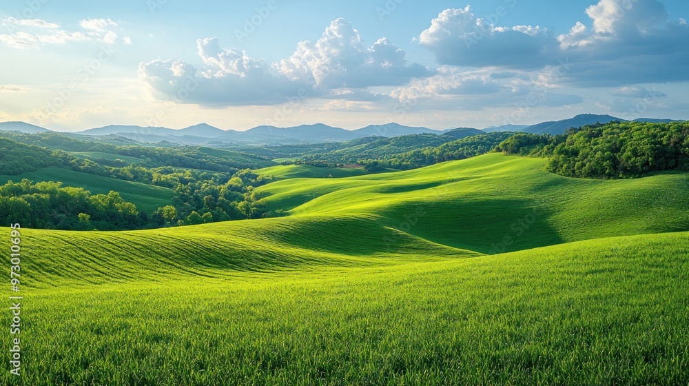 Lush green hills under a bright sky with scattered clouds. Lush green hills under a bright sky with scattered clouds.