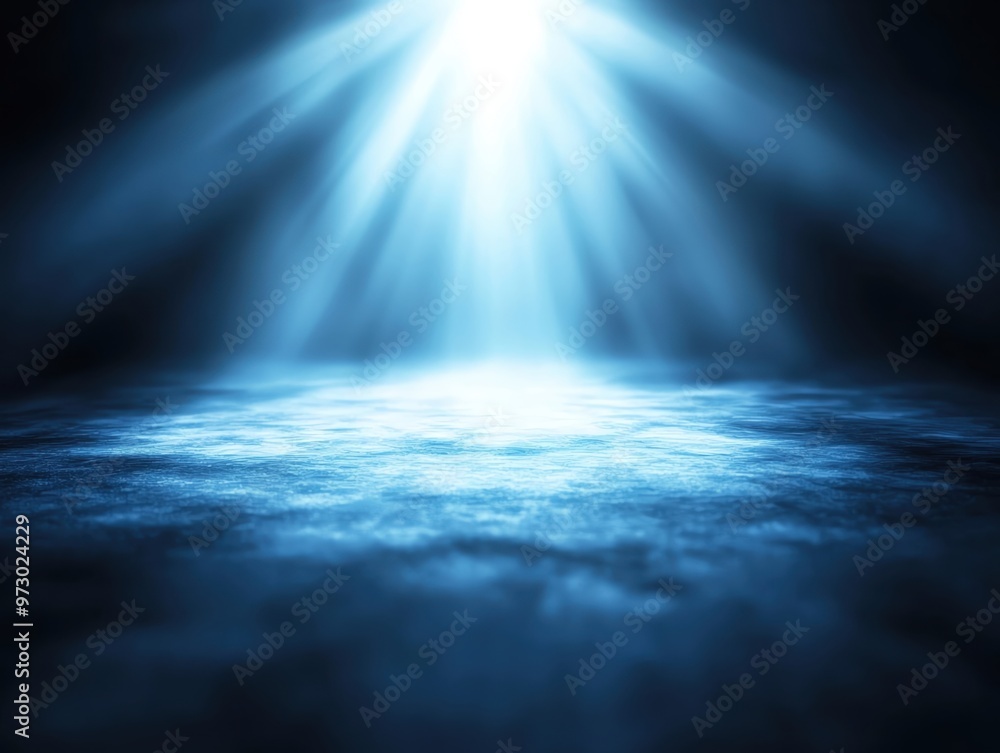 Obraz premium A serene blue ambiance created by soft light rays illuminating a calm surface, ideal for backgrounds and tranquil scenes.