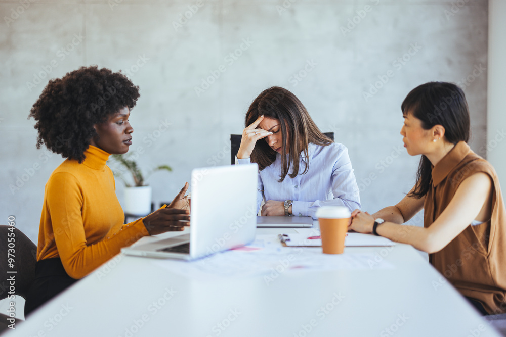 Diverse Team Experiencing Stress During Business Meeting Diverse Team Experiencing Stress During Business Meeting