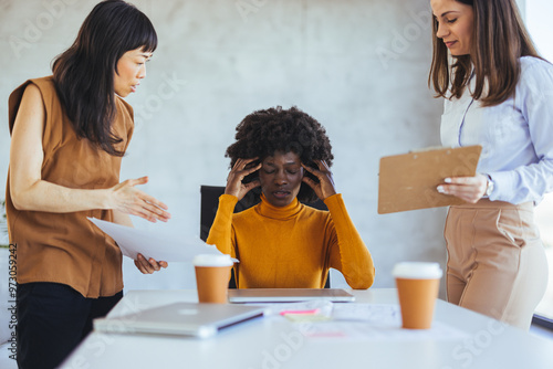 Фотография Stressed Employee in Business Meeting with Colleagues