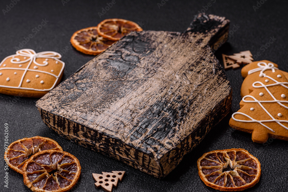 Empty wooden cutting board with copy space with gingerbread cookies and Christmas decor Empty wooden cutting board with copy space with gingerbread cookies and Christmas decor