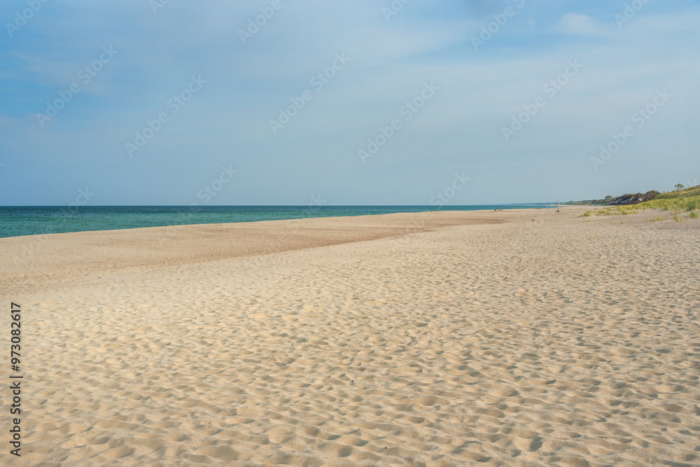 Long white sand beach in the Curonian Spit National Park. Kaliningrad region. Russia Long white sand beach in the Curonian Spit National Park. Kaliningrad region. Russia
