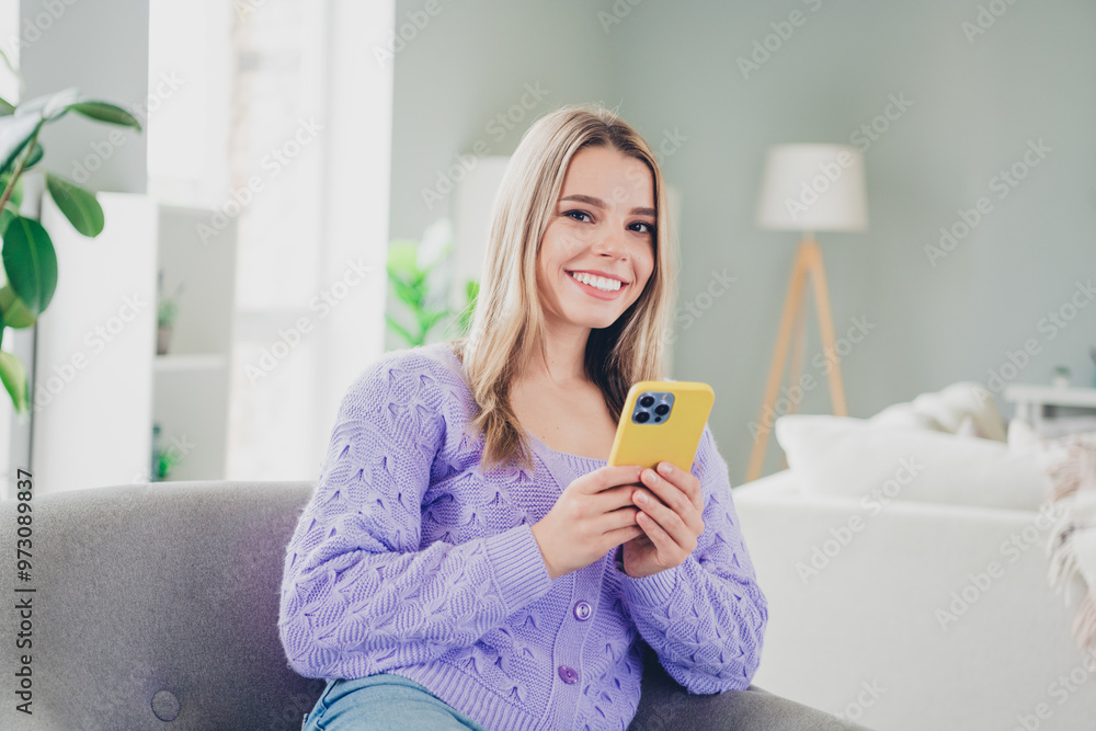 Photo of lovely cheerful girl sit armchair hold gadget dressed violet garment spend pastime spacious house indoors room Photo of lovely cheerful girl sit armchair hold gadget dressed violet garment spend pastime spacious house indoors room