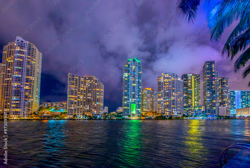 Fototapeta premium Colorful skyscrapers in downtown Miami seen from the river wal