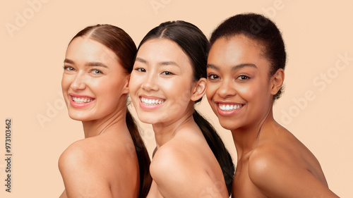 Beauty And Skincare. Portrait Of Three Multiethnic Girls Smiling At Camera Posing Over White Studio Background. Panorama