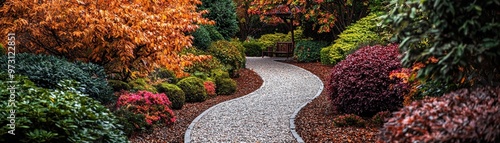 A winding gravel path leads through an autumnal garden framed by lush foliage and a solitary bench