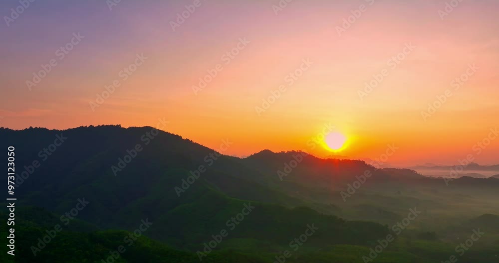 aerial view A serene landscape capturing the soft hues of dawn as mist settles over distant mountain ranges under a pastel-colored sky. Amazing pink sky at sunrise. gradient color sky texture aerial view A serene landscape capturing the soft hues of dawn as mist settles over distant mountain ranges under a pastel-colored sky. Amazing pink sky at sunrise. gradient color sky texture