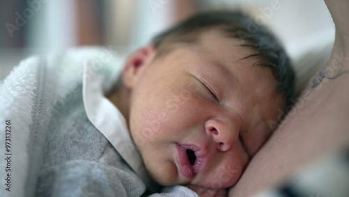 Newborn baby peacefully sleeps on mother’s chest, conveying a deep sense of warmth, security, and the close bond between mother and child in a calm and nurturing environment