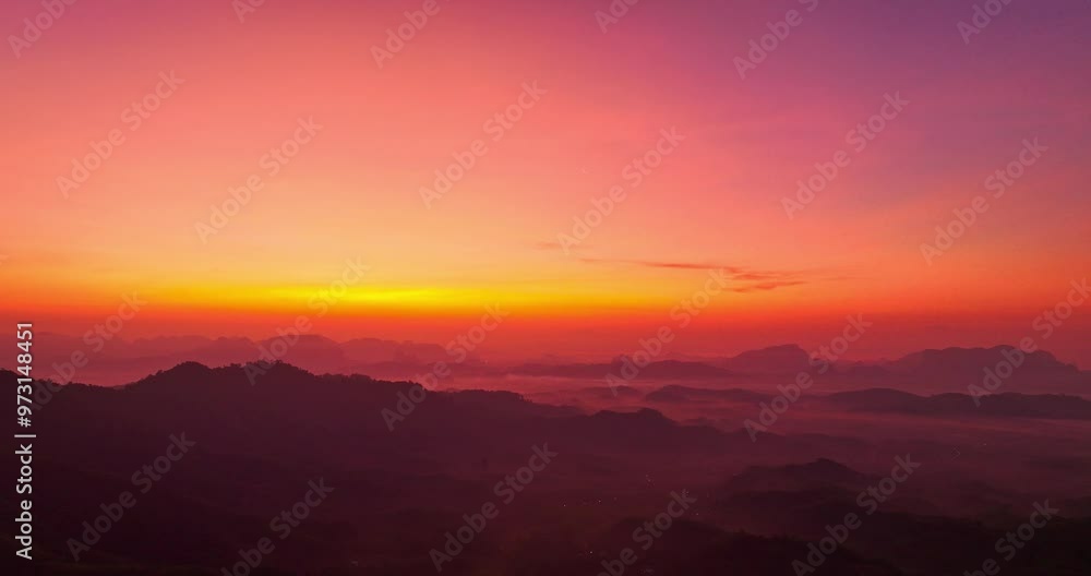 aerial view A serene landscape capturing the soft hues of dawn as mist settles over distant mountain ranges under a pastel-colored sky. Amazing pink sky at sunrise. gradient color sky texture aerial view A serene landscape capturing the soft hues of dawn as mist settles over distant mountain ranges under a pastel-colored sky. Amazing pink sky at sunrise. gradient color sky texture