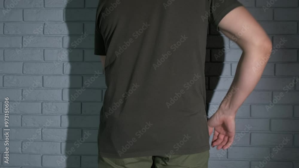 Man with orthopedic problems with belt. A view of man with orthopedic health problems put on the medical corset against muscles pain. Man with orthopedic problems with belt. A view of man with orthopedic health problems put on the medical corset against muscles pain.