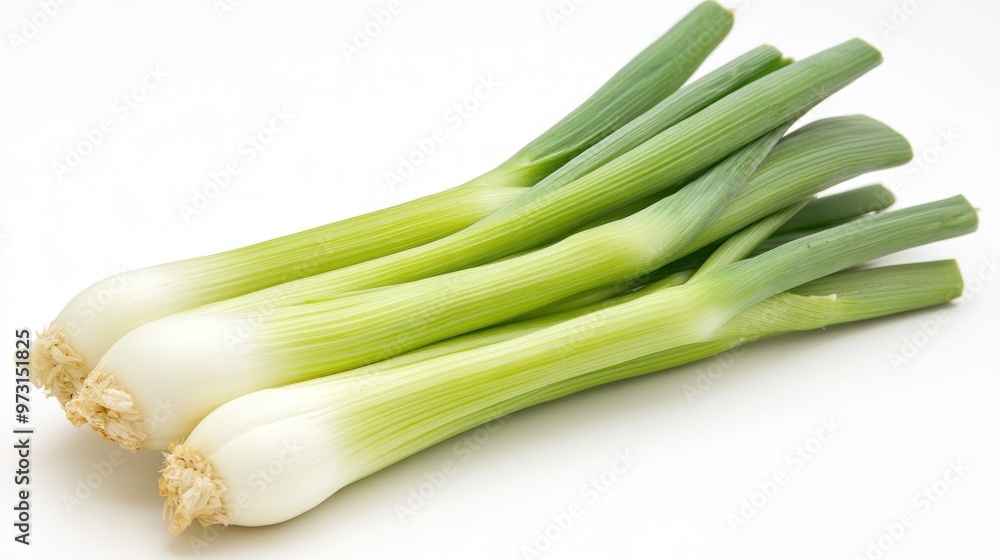 Fresh green onions arranged on a white background, showcasing their vibrant colors. Fresh green onions arranged on a white background, showcasing their vibrant colors.