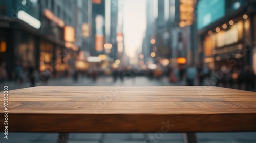 A wooden table in the foreground with a blurred city street scene in the background.