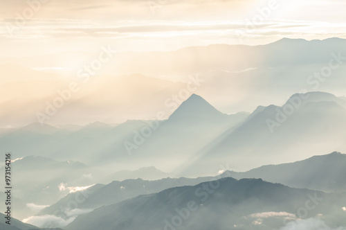 silhouettes of blue mountains in the light of dawn with perfect shapes for wallpapers and desktops in perfect harmony of freedom and calm