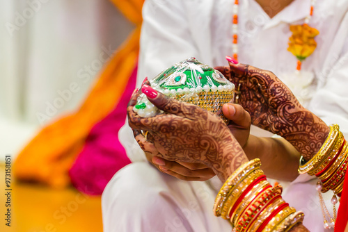 Indian Hindu wedding ritual items hands close up photo