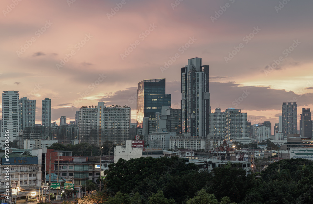 Gorgeous scenic of sunset with beautiful cloud and sky over metropolitan city. Bangkok city skyscrapers after sunset with Beautiful sky background, They can be used as Wallpaper, Copy space, Selective Gorgeous scenic of sunset with beautiful cloud and sky over metropolitan city. Bangkok city skyscrapers after sunset with Beautiful sky background, They can be used as Wallpaper, Copy space, Selective