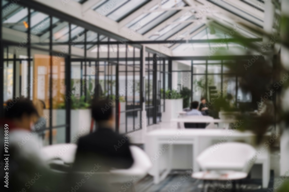 Modern office interior design. Modern office with glass walls, minimalist furniture, and plants for a calming work environment. Modern office interior design. Modern office with glass walls, minimalist furniture, and plants for a calming work environment.
