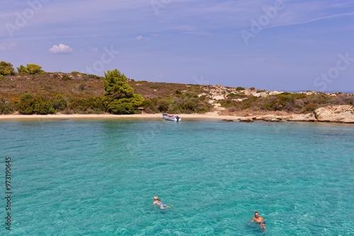 beach and sea in blue lagoone in Diaporos Island, Sithonia - Greece photo